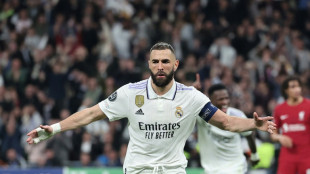 Benzema guides Madrid past Liverpool to reach Champions League quarters