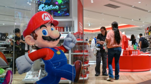 Gold nears $5,000, global stocks muted ending turbulent week