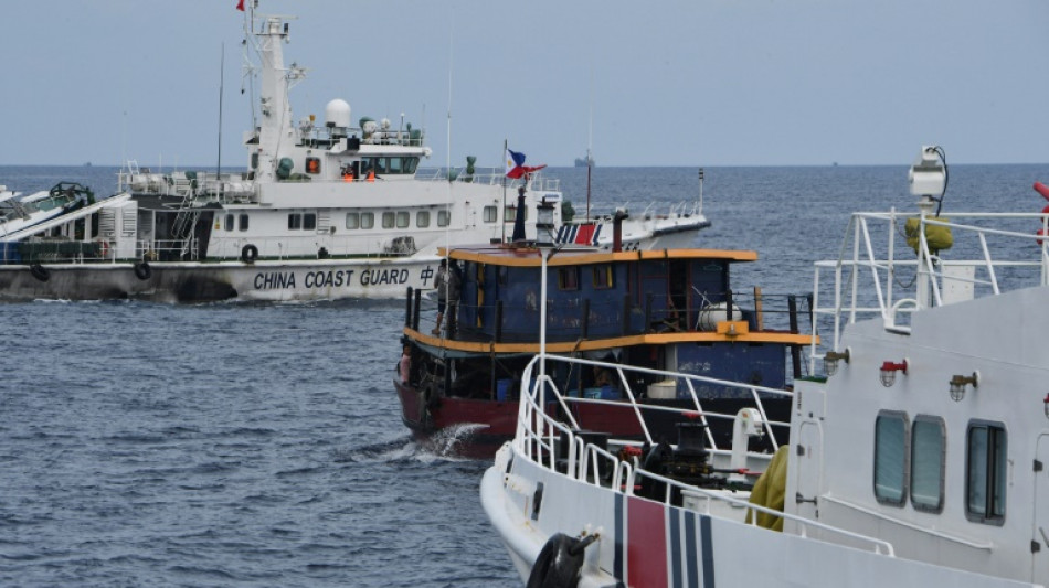 Chinese ships chase, block Philippine boats in disputed sea