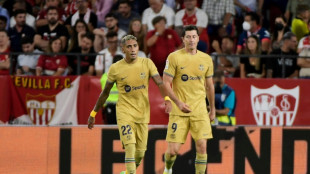 Lewandowski leads Barca to win at Sevilla as Real Madrid stay perfect