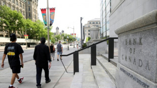 Canada central bank holds key rate steady, says economy improving