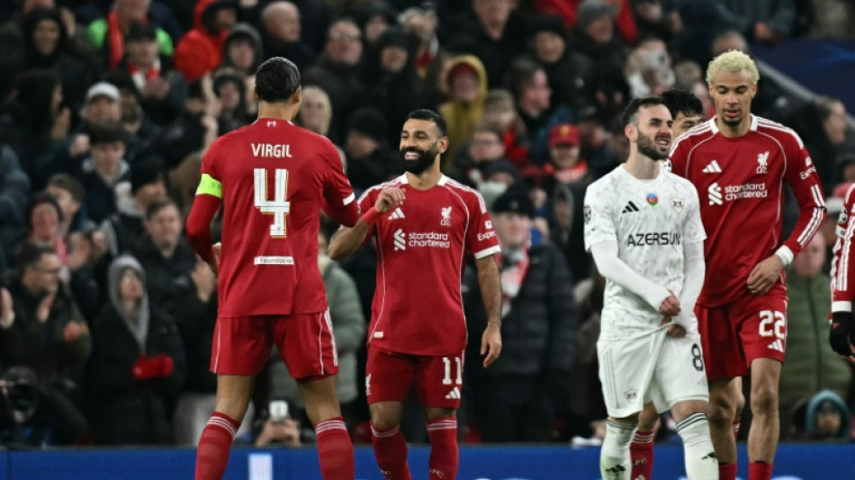 Salah ends drought as Liverpool hit Qarabag for six to reach Champions League last 16