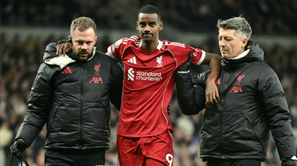 Liverpool sink nine-man Spurs but Isak limps off after rare goal