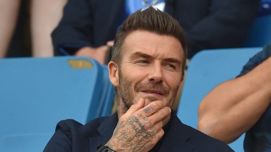 Beckham joins thousands in queue for queen's coffin