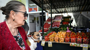 Russia cuts key interest rate, warns of tepid growth