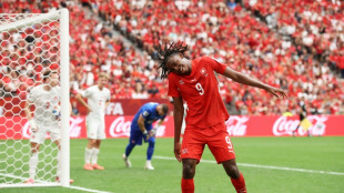 Switzerland down World Cup co-hosts Canada to top Group B, both progress