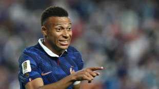 Mbappe scores twice as France beat Iraq at World Cup after two-hour storm delay