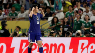 Japan stroll to victory over Tunisia in World Cup's 1,000th game