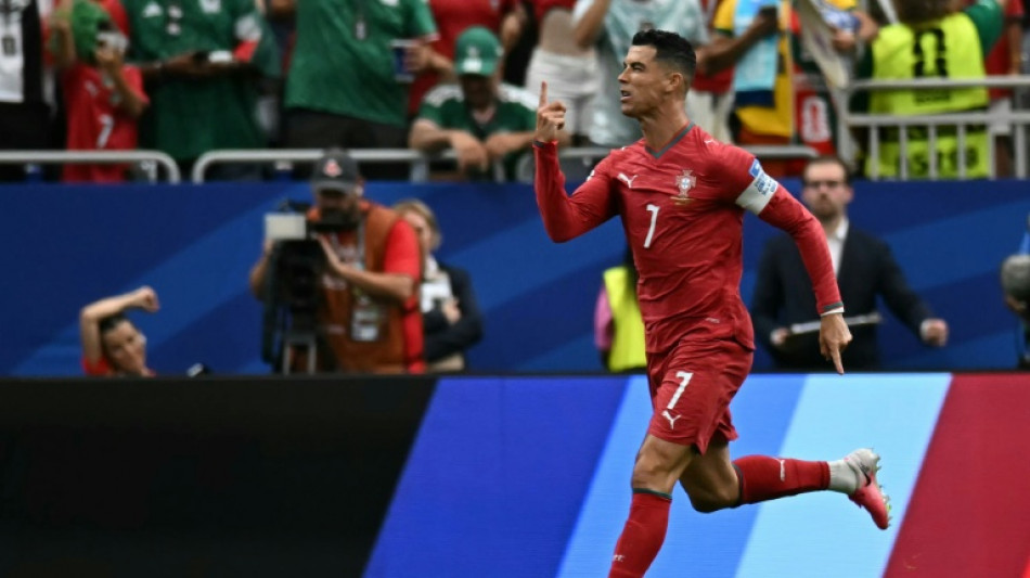 Ronaldo double fires Portugal, England eye last 32 
