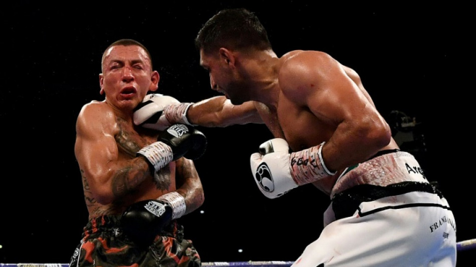 Ex-world champion Khan handed two-year doping ban