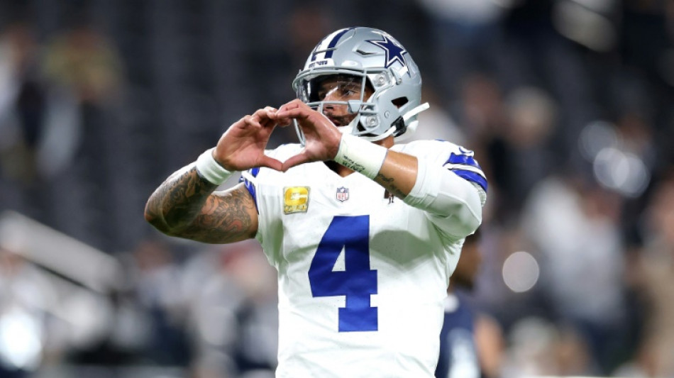 Grieving Cowboys remember Kneeland, defeat Raiders