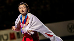 Japan's Sakamoto survives wobble to retain world skating title
